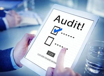 Business team organizing financial documents and tax records for audit in Pakistan