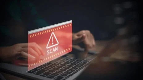 A forensic accountant analyzing financial records and digital transactions to detect corporate fraud